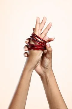 Women's hands wearing bangles Stock Photos