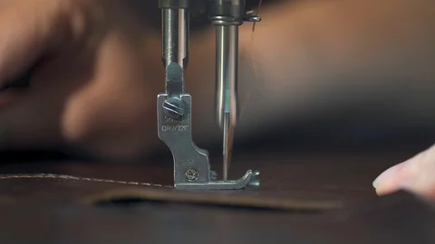 Women's hands at work on the sewing machine. making leather goods. close-up Video stock 111930486