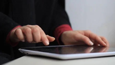 Women's hands work with a tablet computer Stock Footage 100221740