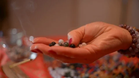 Women's hands works with Corals to make a Coral Bracelets on a Table Stock Footage 101666794
