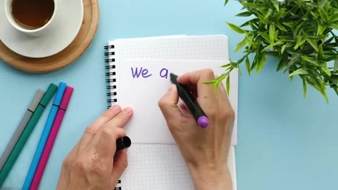 Women's hands write the phrase we are hiring with a marker Stock Footage 199254061