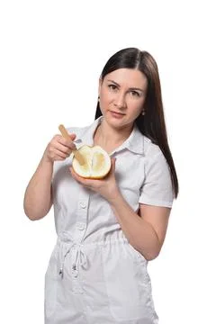 Women's intimate depilation concept on the example of a grapefruit in the hands Stock-Fotos