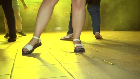 Women's legs in heels dancing on the dance floor in a club Stock Footage 293180924