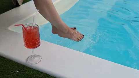 Women's legs in the pool 스톡 동영상 342593209