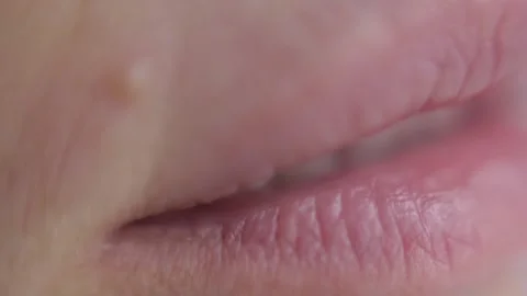Women's lips without makeup macro shot, selective focus Stock Footage 141723807