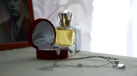 Women's perfume are on the table and close decorations video Vídeo Stock 66777402
