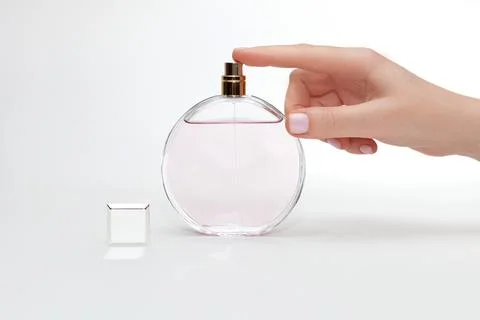 Women's perfume on a light background Stock Photos