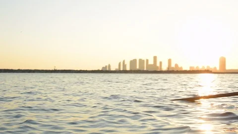 Women's quad rowing team pushing away from dock as they get ready for training. 库存影片 88833867