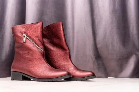 Womens red fashion boots stay on floor , copy space Stock Photos