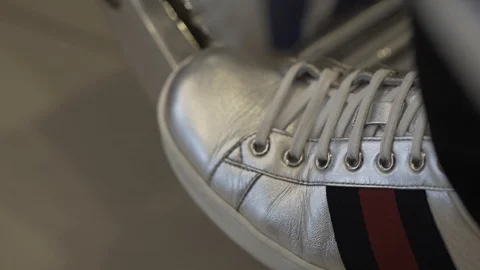 Women's Silver Sneaker on the leg Stock Footage 95048870
