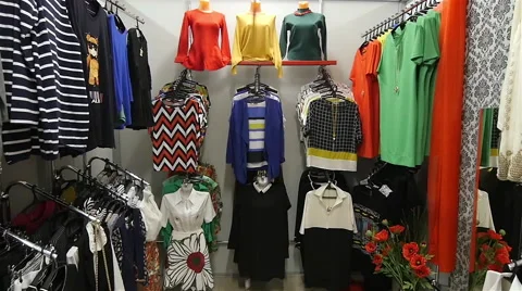 Women's Sweaters hanging in the Store Video stock 61986518
