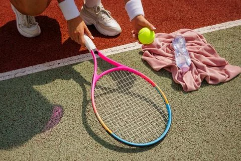 Women's Tennis Training Session with Racket and Ball on Court Stock Photos