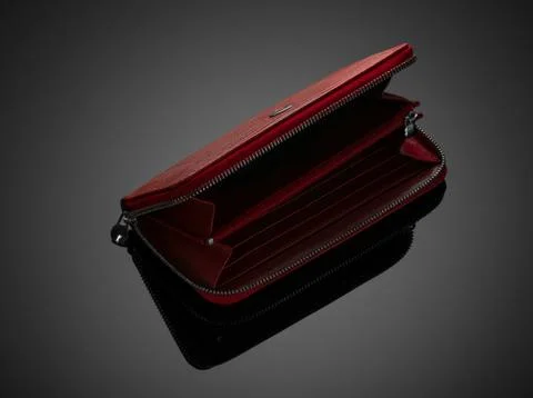 Women's wallet on a black background Stock Photos