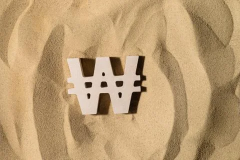 Won Sign On the Sand Stock Photos