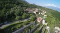 Wonderful aerial drone shot of houses placed on Monte Baldo mountains in Italy 4k or 4k+ Resolution