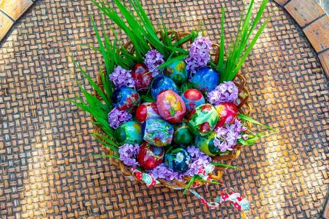 Wonderful decorated basket full of Easter eggs Stock Photos