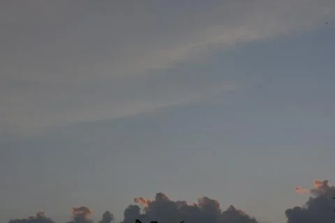 Wonderful dramatic clouds formation at the sky Stock Photos