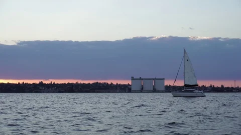 Wonderful low angle panorama view on cloudy sunset evening sky over small yacht Stock Footage 94870370