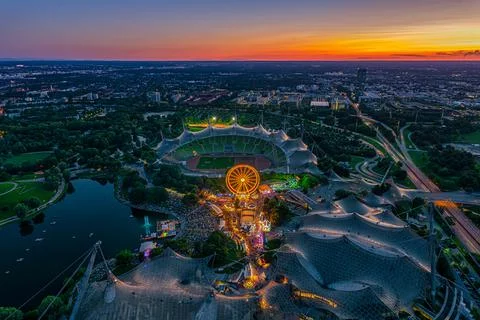 Wonderful Munich sunset from a high view with a festival at the popular Olympic Stock Photos