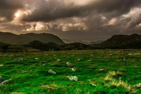 Wonderful nature background in mountains. Green fields landscape. view in t.. Stock Photos