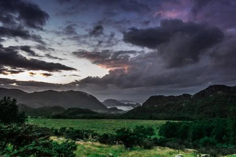 Wonderful nature background in mountains. Green fields landscape. view in t.. Stock Photos