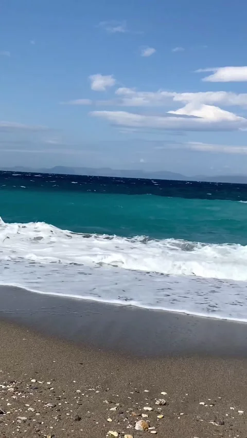 Wonderful sandy pebble beach between two capes in Greece Stock Footage 242786649