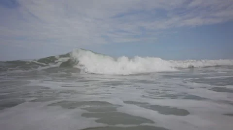 Wonderful sea wave breaking on the camera in a thousand sea spray. Video stock 42884476