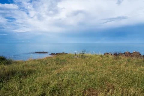 Wonderful seaside view with empty table and chair near the beach 스톡 사진