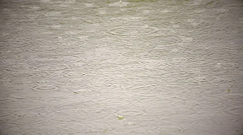 Wonderful slow motion of rain dropping on sepia water surface with vignette Stock Footage 52769595