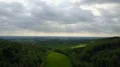 Wonderful spring season landscape aerial with green corn field forest and clouds 4k or 4k+ Resolution