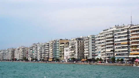 Wonderful steady low angle view on crowded modern hotel villas sea front quay of Stock Footage 94920942