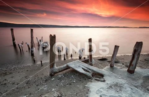 Wonderful sunset at a winter lake Stock Photos