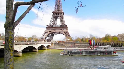 Wonderful view on Eiffel tower, cruise boat and bridge. Stock Footage