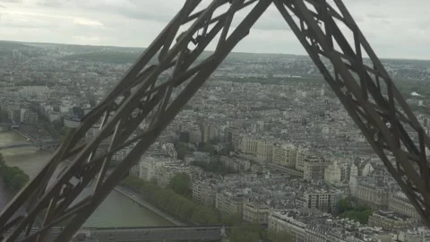 Wonderful view of Paris from moving Eiffel Tower lift in sunrise or sunset light Stock Footage 272439799
