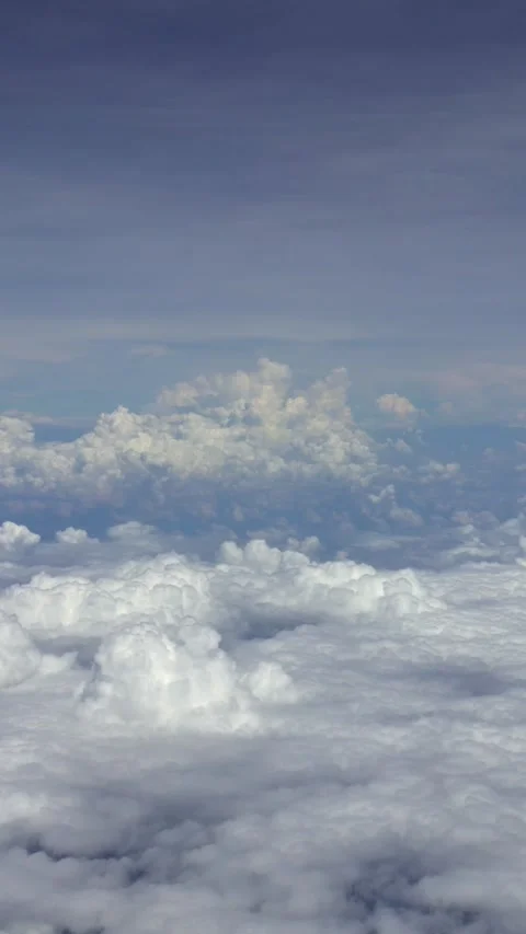 Wonderful view of sky and clouds from above, seen through airplane window Stock Footage 332065838