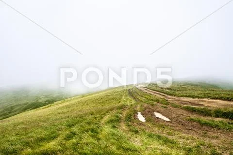 Wonderful view of Ukrainian Carpathian mountains in fog Stock Photos