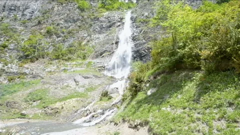 Wonderful waterfall in the middle of the forest in Ordesa National Park, Spai Видео 99001039