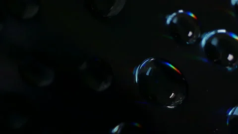 Wonderful world of physics. Interference and diffraction. Water drops close up w Stockbeeldmateriaal 90988628