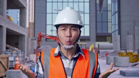 Wondering Engineer Saying Why Working Doubtfully at Construction Site Stock Footage 325854849