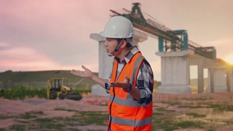 Wondering Engineer Saying Why Working Doubtfully at Construction Site Stock Footage 330330699