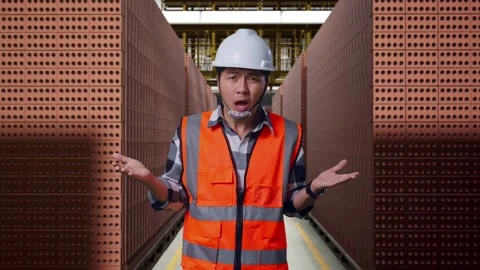 Wondering Male Engineer Saying Why Working Doubtfully With Brick In Stacks Stock Footage 303759558