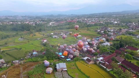 At Wonosobo in central Java, the hot air balloons are ready to take off Stock Footage 241307337
