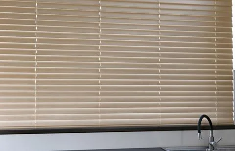 Wood automatic blinds in kitchen Foto stock