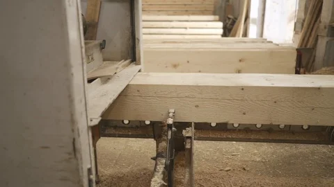 Wood beams processed in a grinding machine production of wooden houses Video stock 116767318