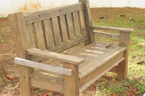Wood bench under a tree Stock Photos