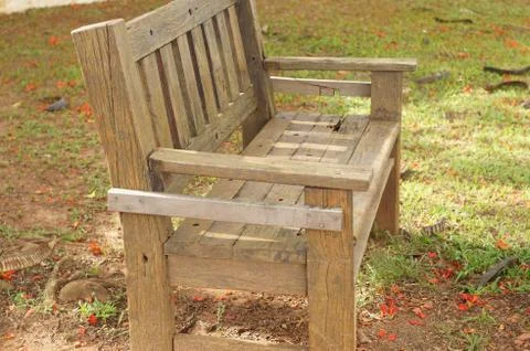 Wood bench under a tree Stock Photos