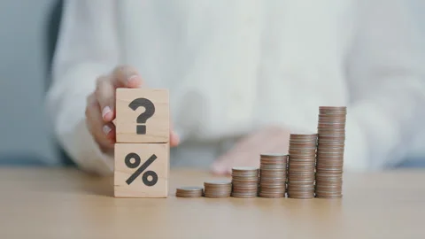 Wood block of Question mark, coin stack and Percentage. Interest rate, GDP,.. Stock Footage 285487483