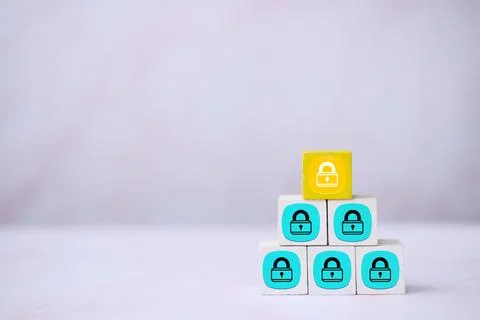 Wood block stacking with lock icon to protect the security Stock Photos