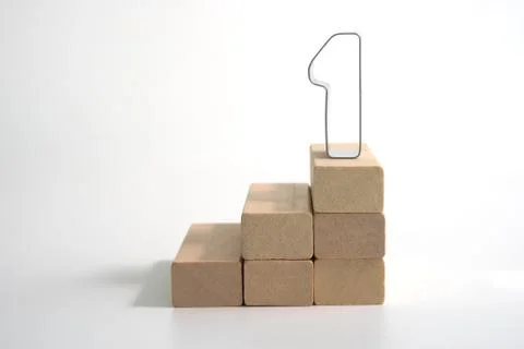 Wood block stacking as step stair with number 1. Stock Photos