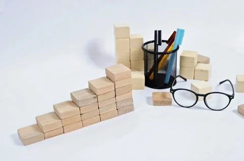 Wood block stacking as step stair on wooden table. Business concept for growt Stock Photos